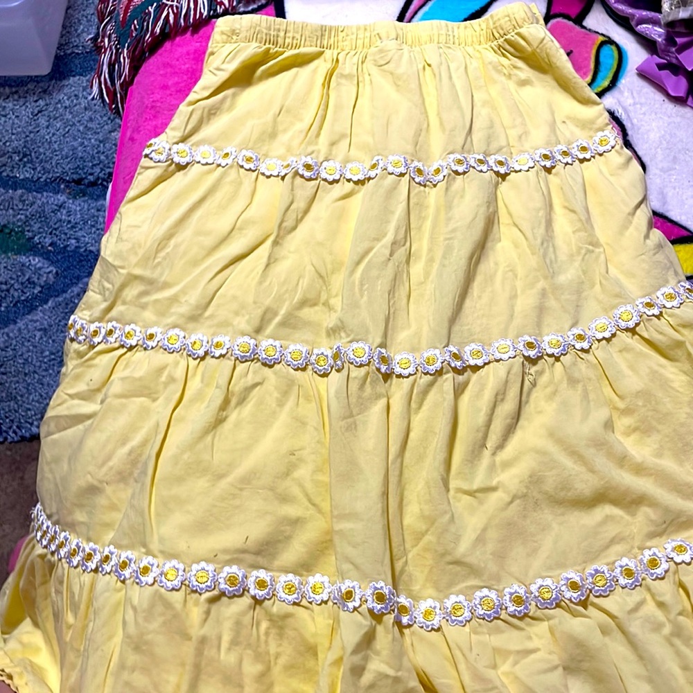 Really cute yellow skirt with white flowers. Never really wore it.